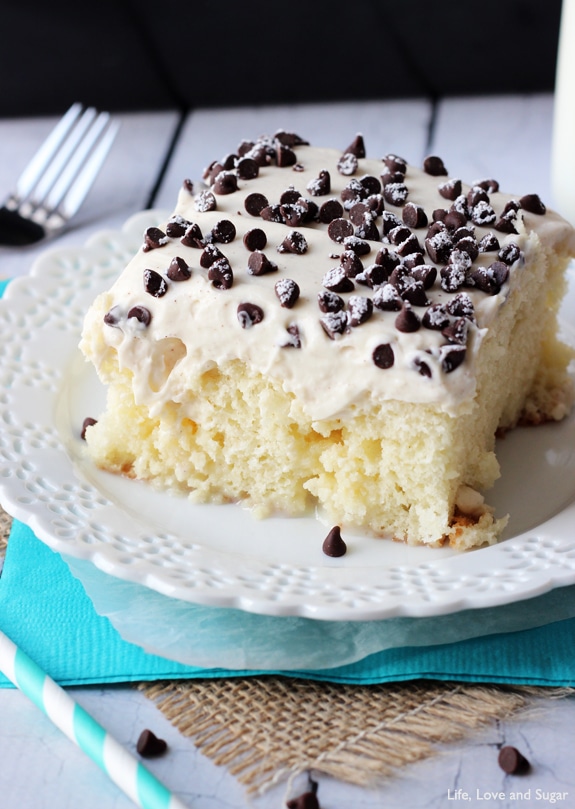 Cannoli Poke Cake - vanilla cake topped with cannoli filling icing!