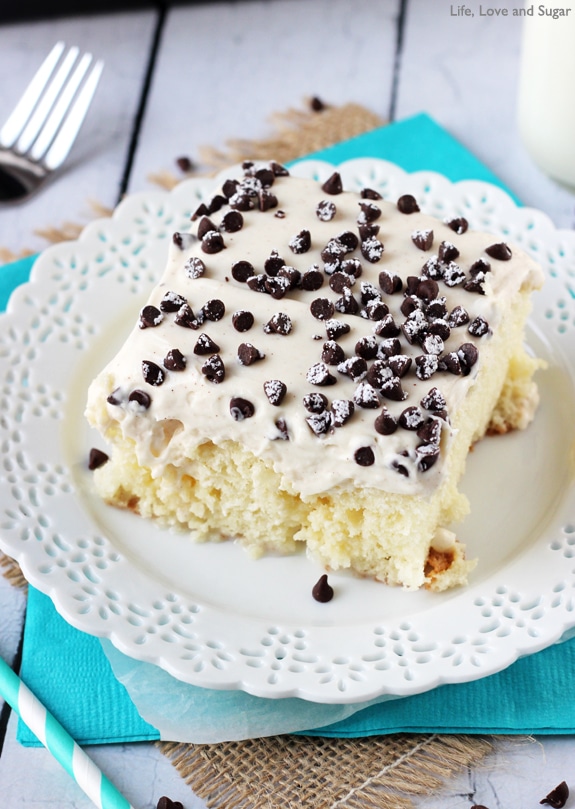 Cannoli Poke Cake - vanilla cake topped with cannoli filling icing!