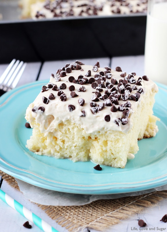 Cannoli Poke Cake - vanilla cake topped with cannoli filling icing!