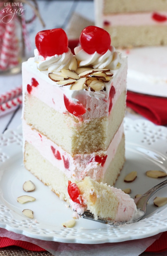 Image of a Cherry Almond Amaretto Ice Cream Cake Slice with a Bite on a Fork
