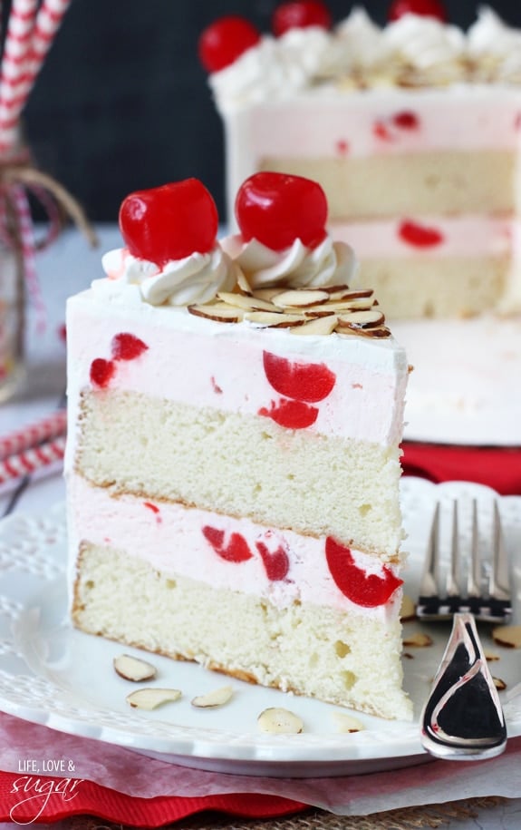 Image of a Slice of Cherry Almond Amaretto Ice Cream Cake on a Plate with a Fork
