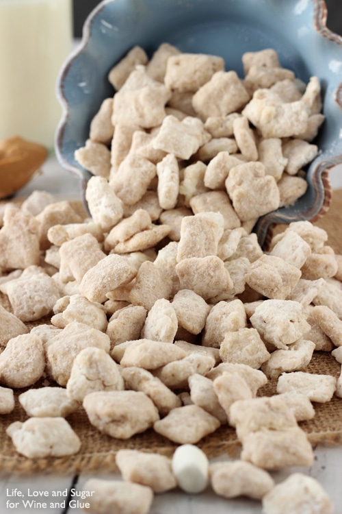 Fluffernutter Puppy Chow pouring out of a blue bowl