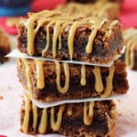 Caramel Nutella Pretzel Brownies stacked on wax paper