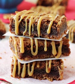 Caramel Nutella Pretzel Brownies stacked on wax paper