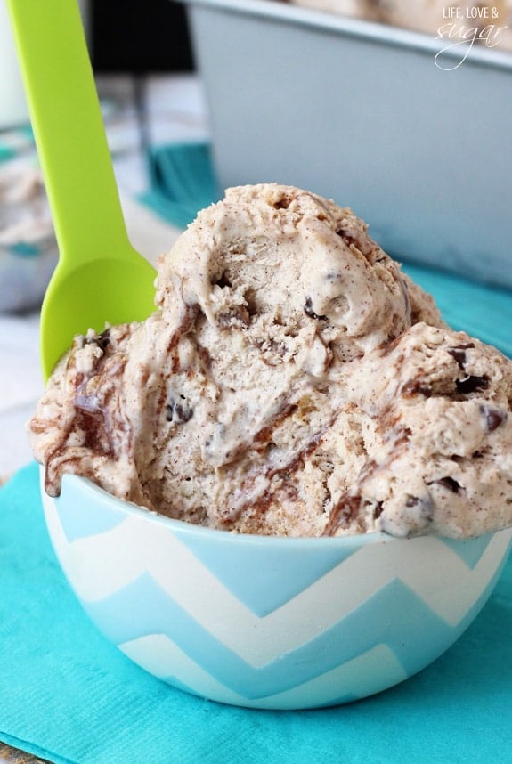 Oatmeal Chocolate Chip Cookie Ice Cream in a blue and white bowl with a green plastic spoon