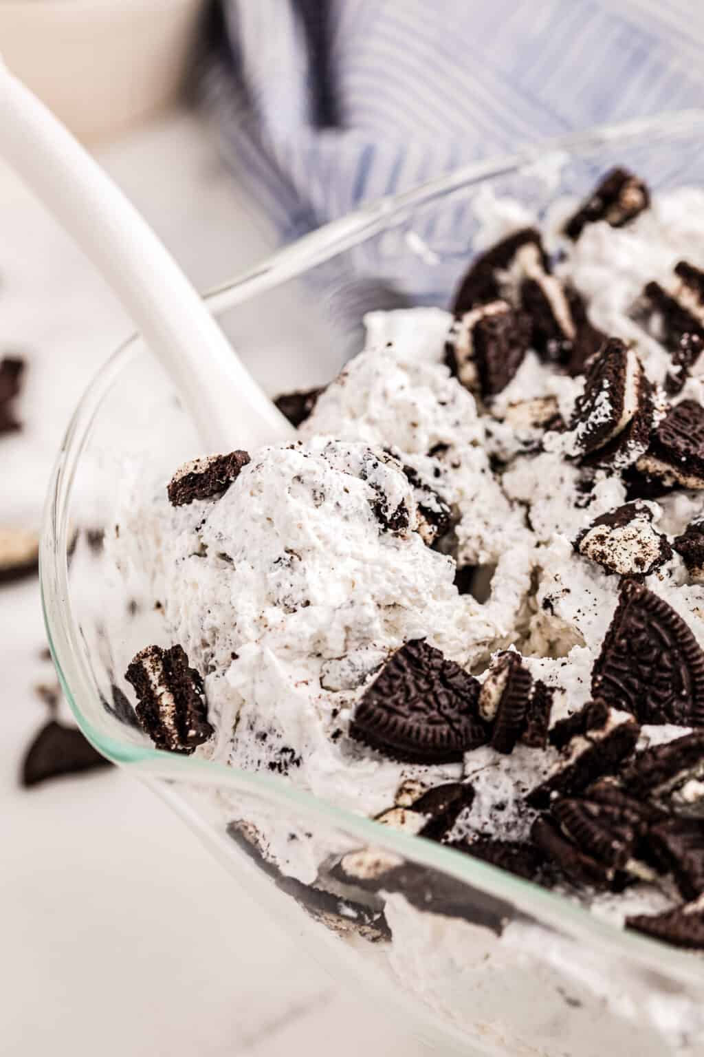 A clear glass bowl filled with Oreo Fluff.