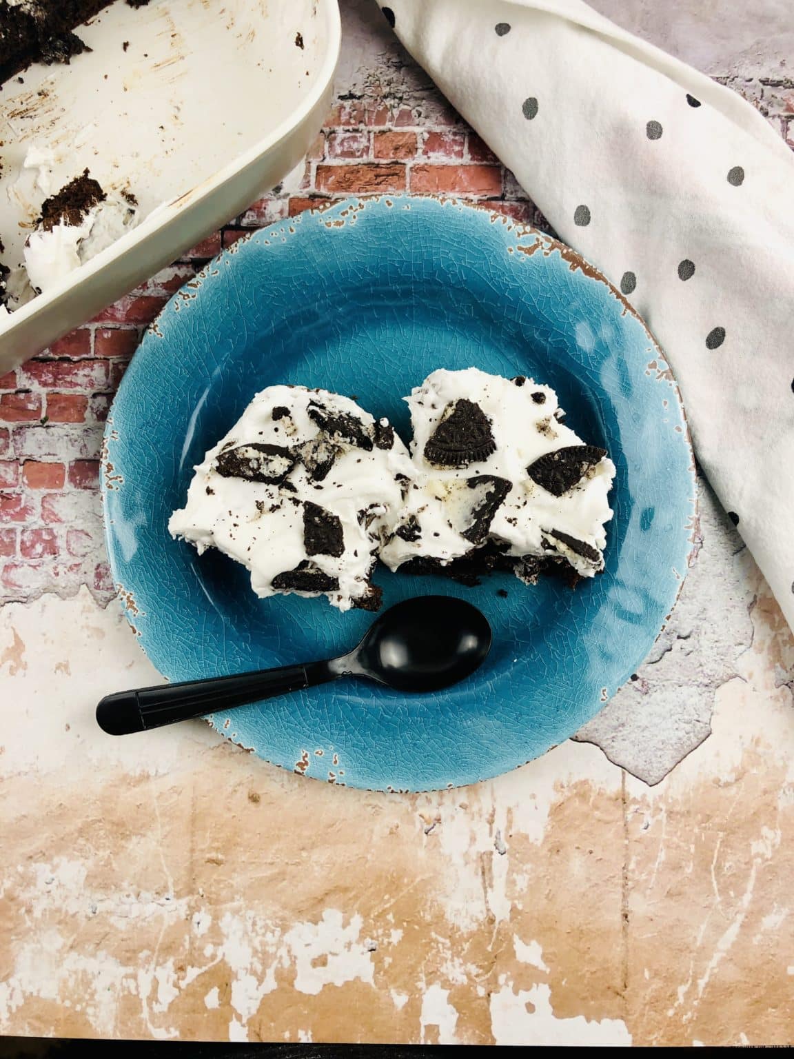 Top view of a teal plate with a serving of Oreo Dump Cake. 