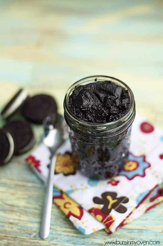 A jar of Oreo Cookie Spread on a colorful napkin.