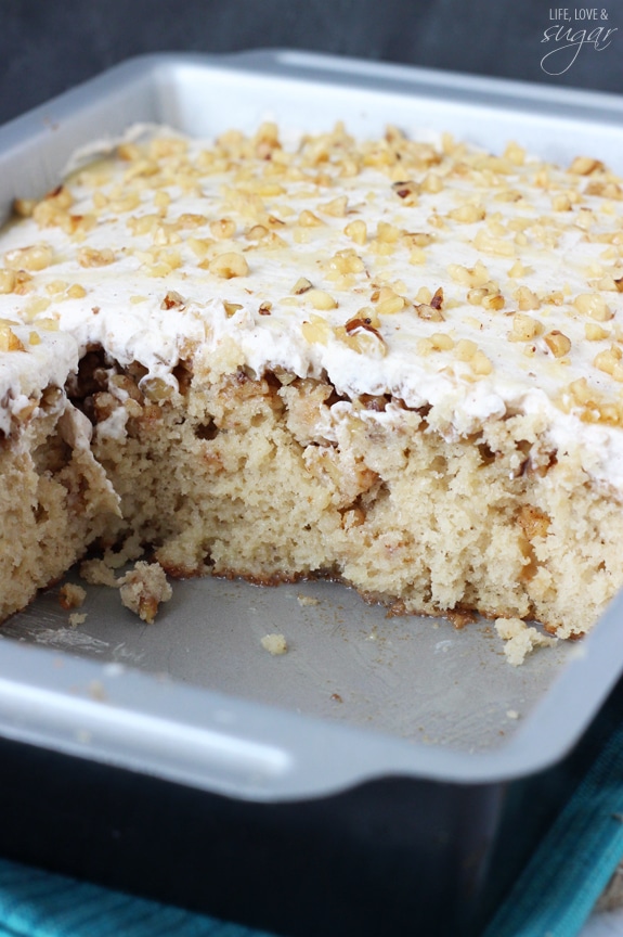 Baklava Poke Cake in a pan with several pieces missing