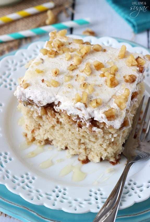 Overhead view of a piece of Baklava Poke Cake on a white plate