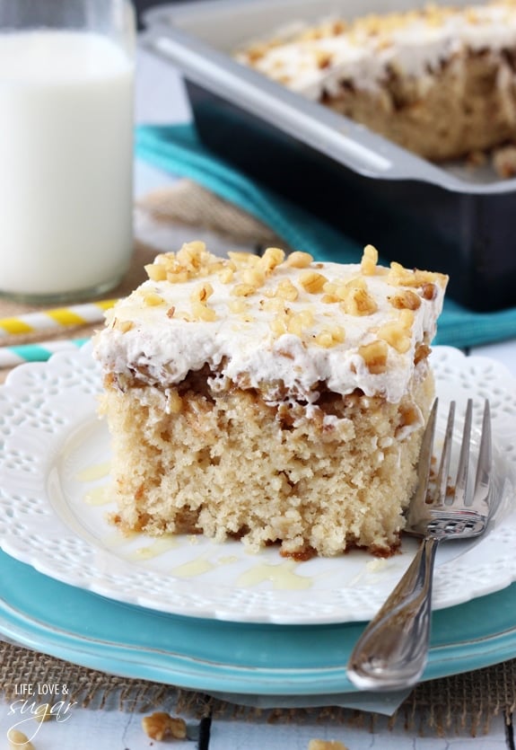 A piece of Baklava Poke Cake on a plate with a fork