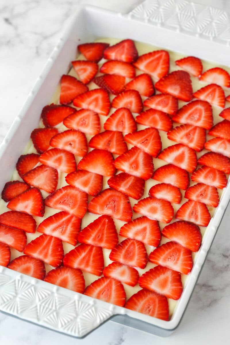 icebox cake after adding a layer of thinly sliced strawberries