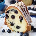 A Slice of Blueberry Coconut Bundt Cake on a plate