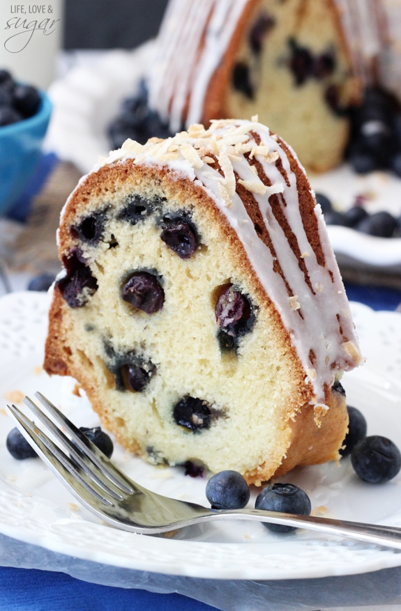 A slice of Blueberry Coconut Bundt Cake on a plate