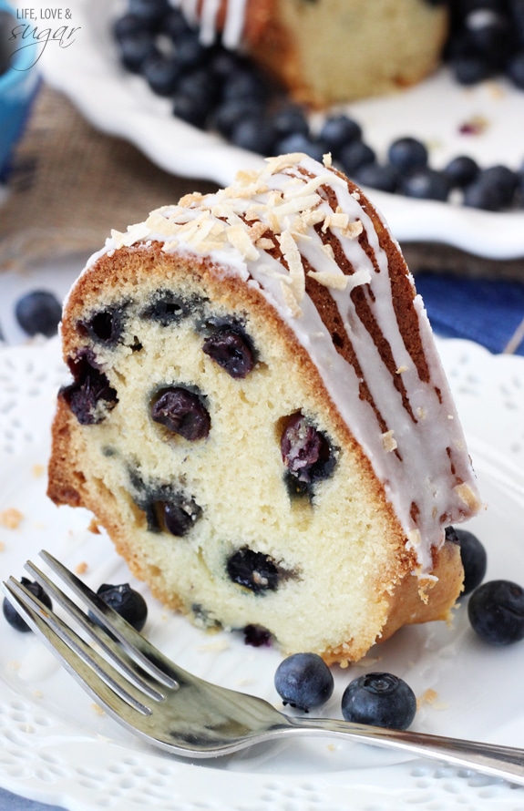 A slice of Blueberry Coconut Bundt Cake on a plate