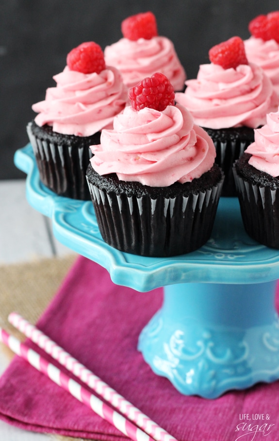 Raspberry Chocolate Cupcakes on a blue pedestal