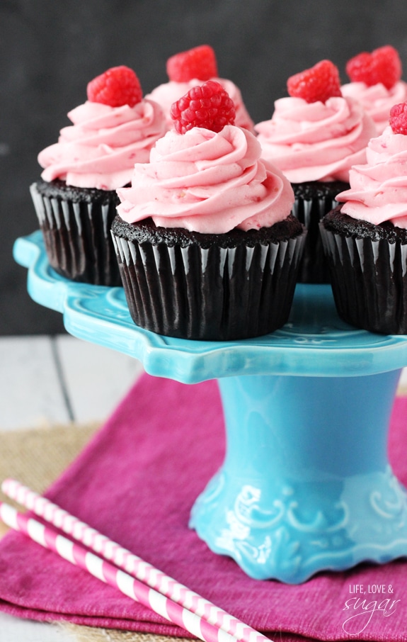 Raspberry Chocolate Cupcakes on a blue stand