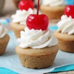 Root Beer Float Cookie Cups topped with a cherry