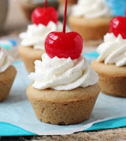 Root Beer Float Cookie Cups topped with a cherry