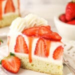 slice of strawberry shortcake cheesecake on white plate