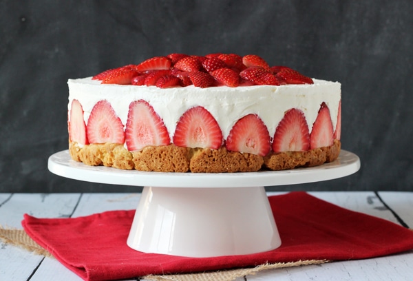 Strawberry Shortcake Cheesecake - shortcake topped with strawberries, no bake vanilla cheesecake and whipped cream!