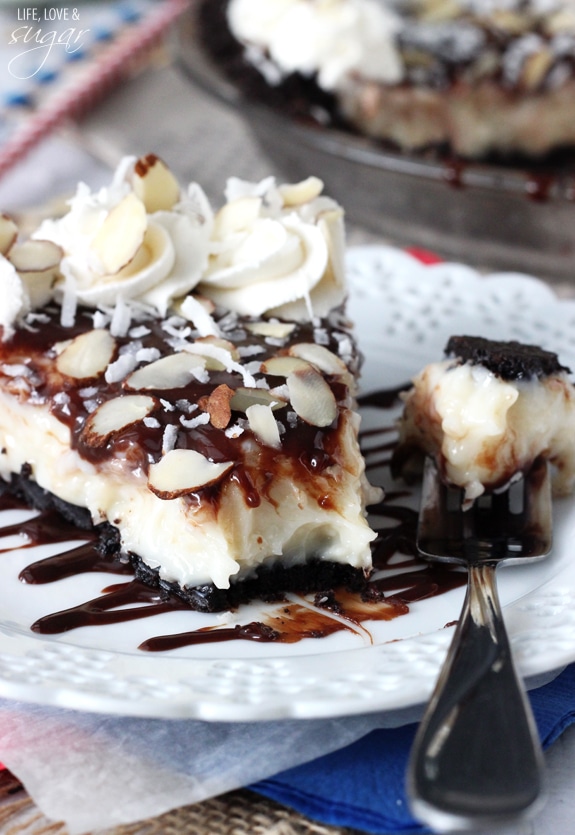 Almond Joy Pie slice on a plate with a bite on a fork