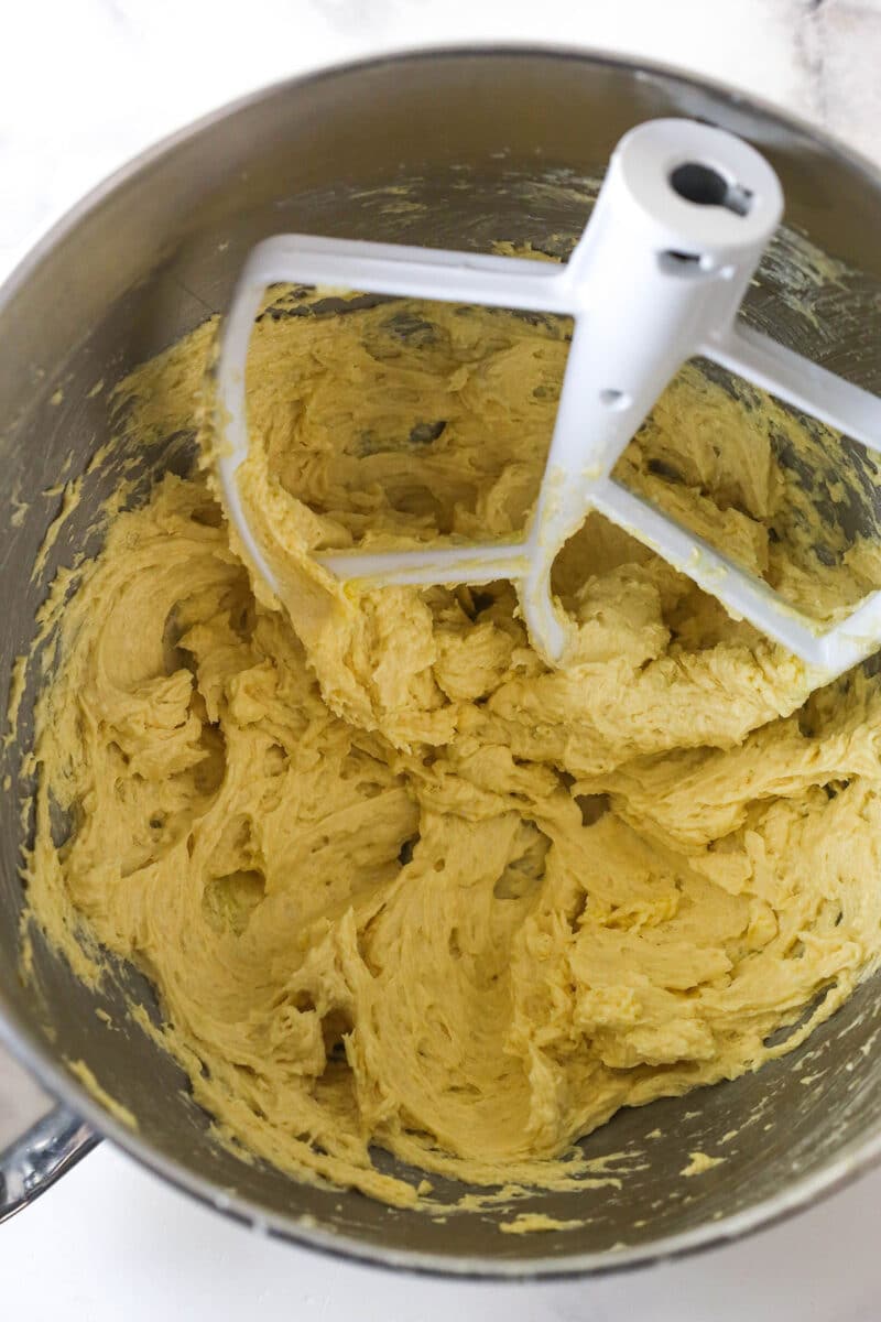 Egg added to creamed butter and sugar in a mixing bowl