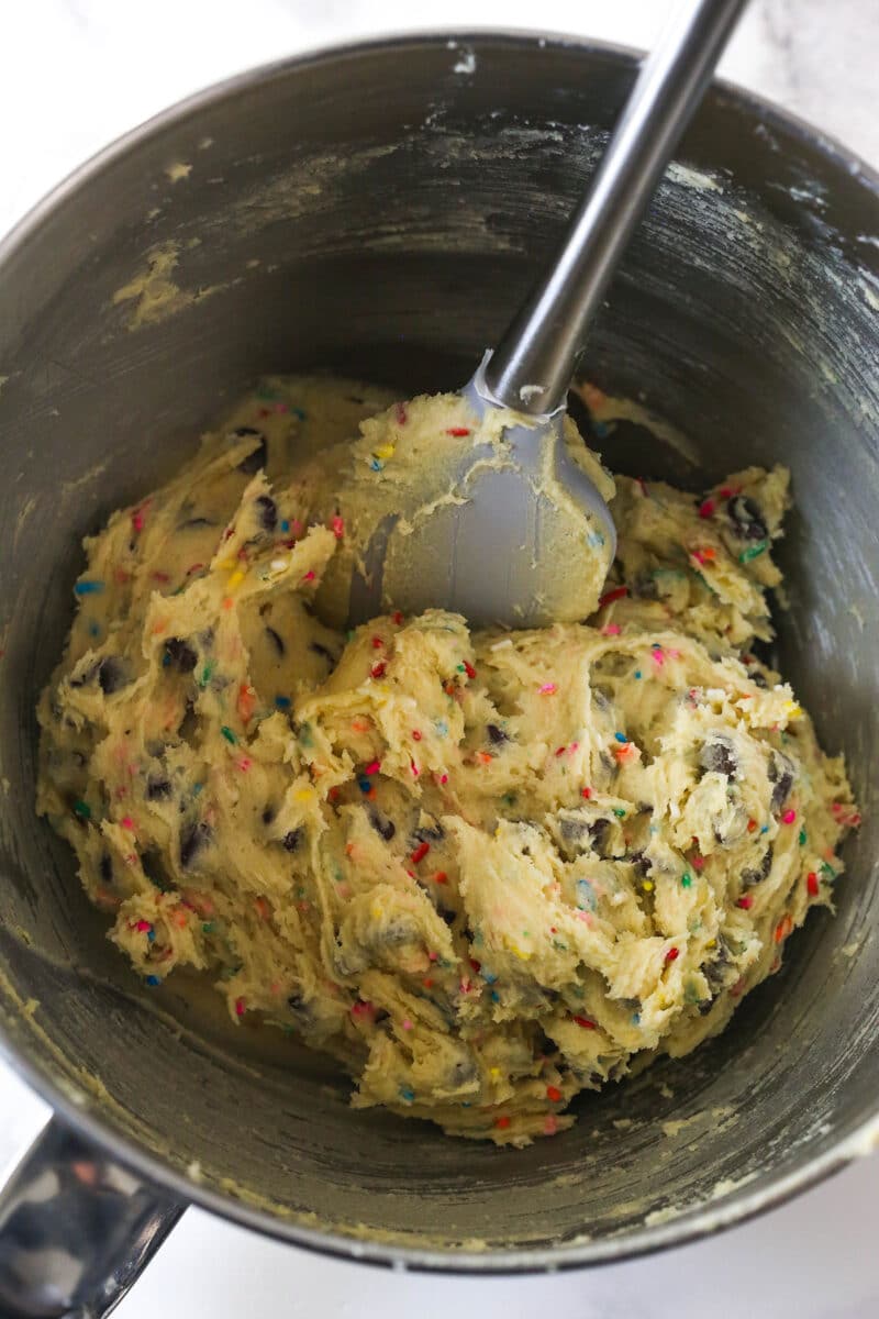 Sprinkles and chocolate chips folded into cookie dough