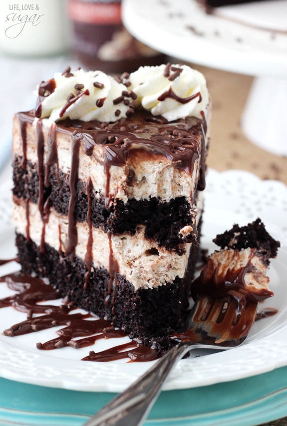 Hot Fudge Swirl Ice Cream Cake slice on a plate with a bite on a fork