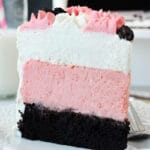 Neapolitan Millionaire Cake slice on white plate