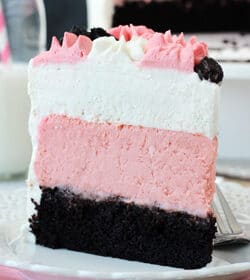 Neapolitan Millionaire Cake slice on white plate
