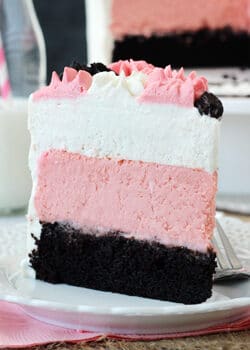 Neapolitan Millionaire Cake slice on white plate