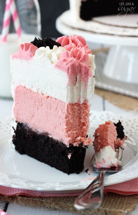 Neapolitan Millionaire Cake slice on a white plate