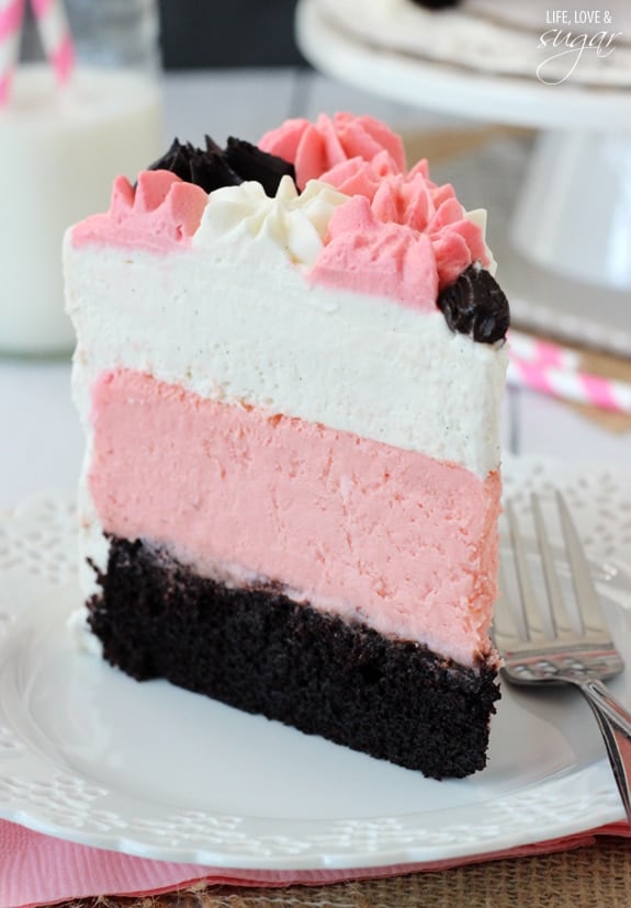 Neapolitan Millionaire Cake slice on a white plate