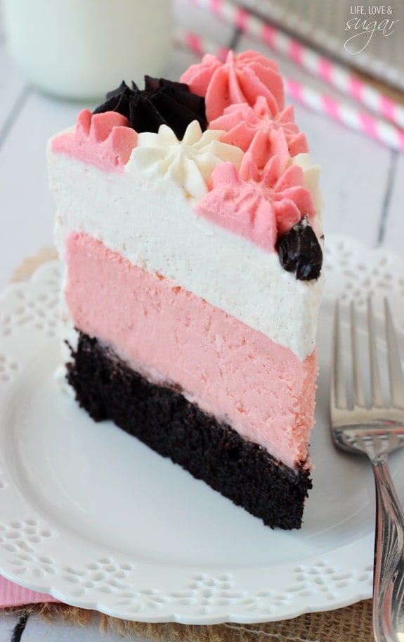 Neapolitan Millionaire Cake slice on a white plate