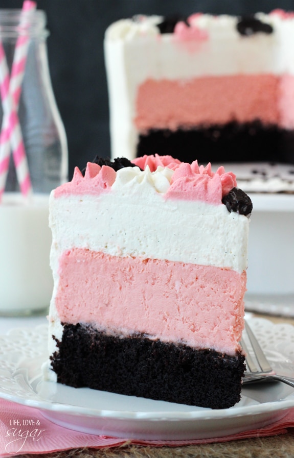 Neapolitan Millionaire Cake slice on a white plate