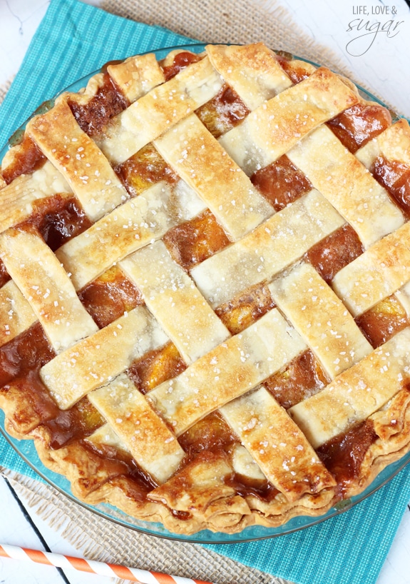 Top view of a whole Peach Pie on a blue cloth