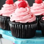 Raspberry Chocolate Cupcakes on blue stand