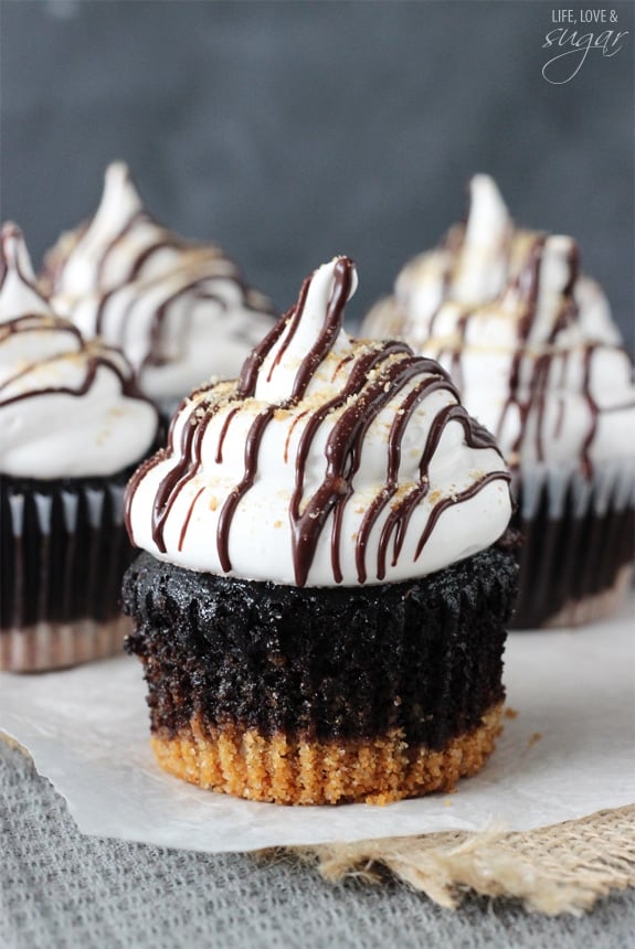 S'mores Cupcakes - super moist chocolate cupcakes with a graham cracker crust, topped with a light marshmallow frosting!
