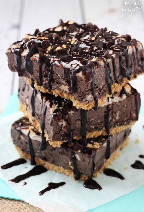 Smores Ice Cream Bars stacked on parchment paper