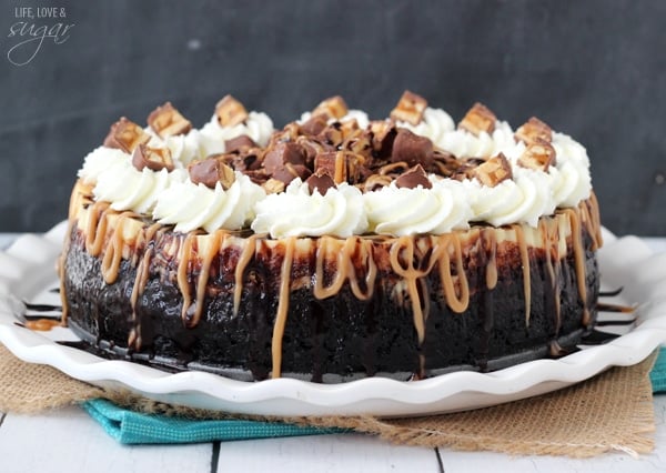 Snickers Cheesecake on a white plate