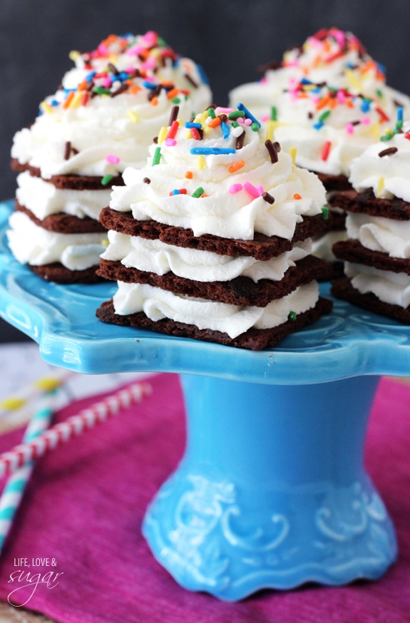 Birthday Cake Brownie Brittle Icebox Cupcakes on a blue cake stand