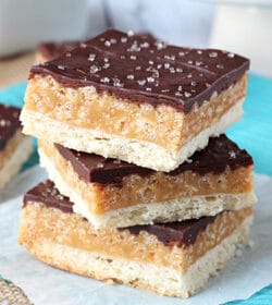 Caramel Shortbread Bars stacked on wax paper