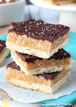 Caramel Shortbread Bars stacked on wax paper
