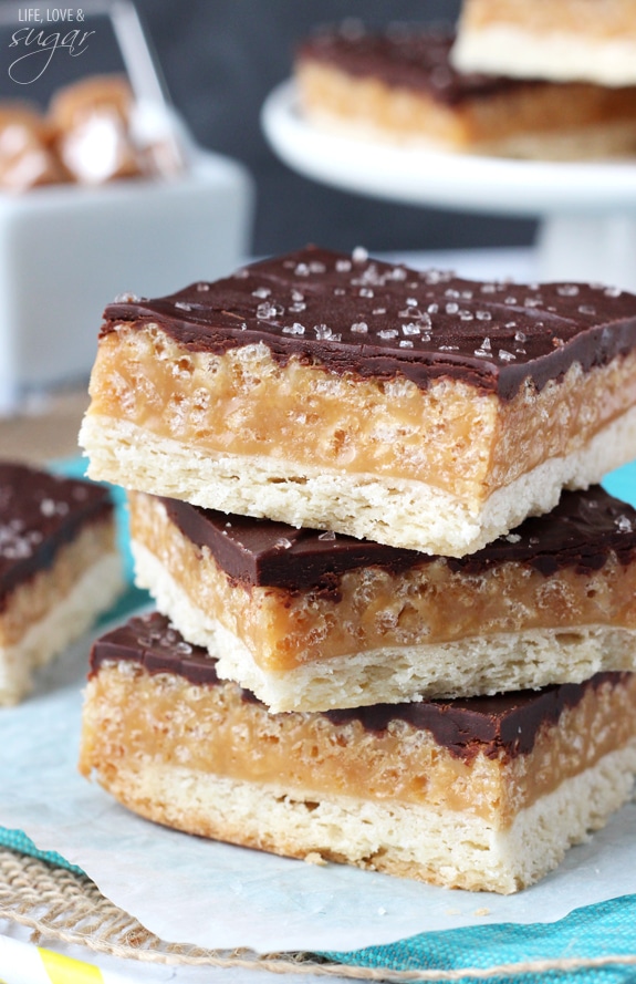 A Close-Up Shot of Three Stacked Chocolate Caramel Cookie Bars Topped with Sea Salt