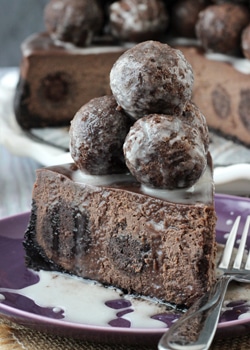 Chocolate Donut Hole Cheesecake slice on purple plate