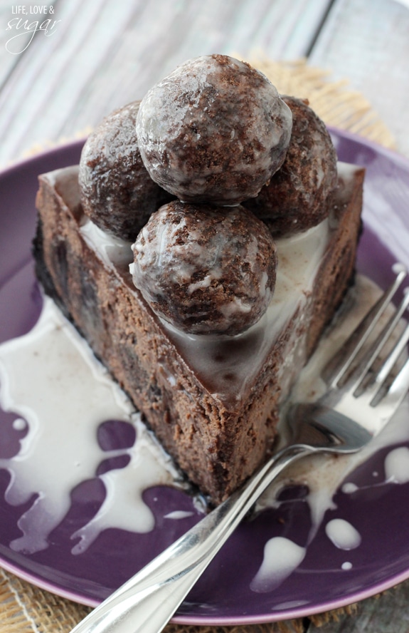 A Slice of Chocolate Donut Hole Cheesecake on a purple plate
