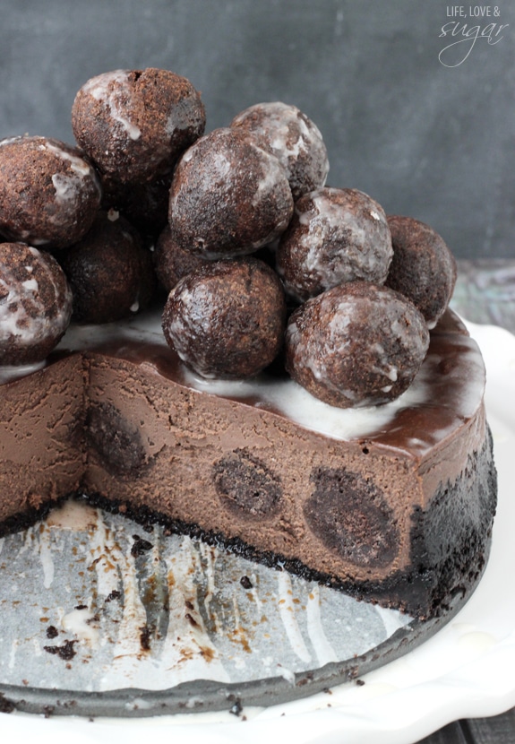 Chocolate Donut Hole Cheesecake with a slice removed