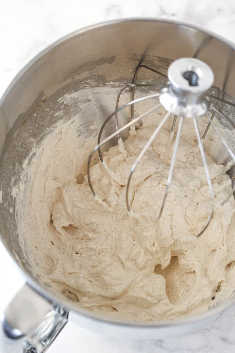 Whipped cinnamon frosting in a bowl
