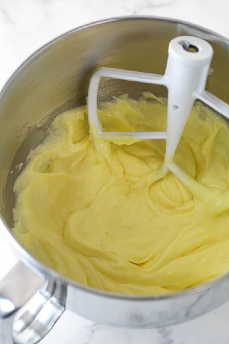 cake batter in a mixing bowl after adding eggs